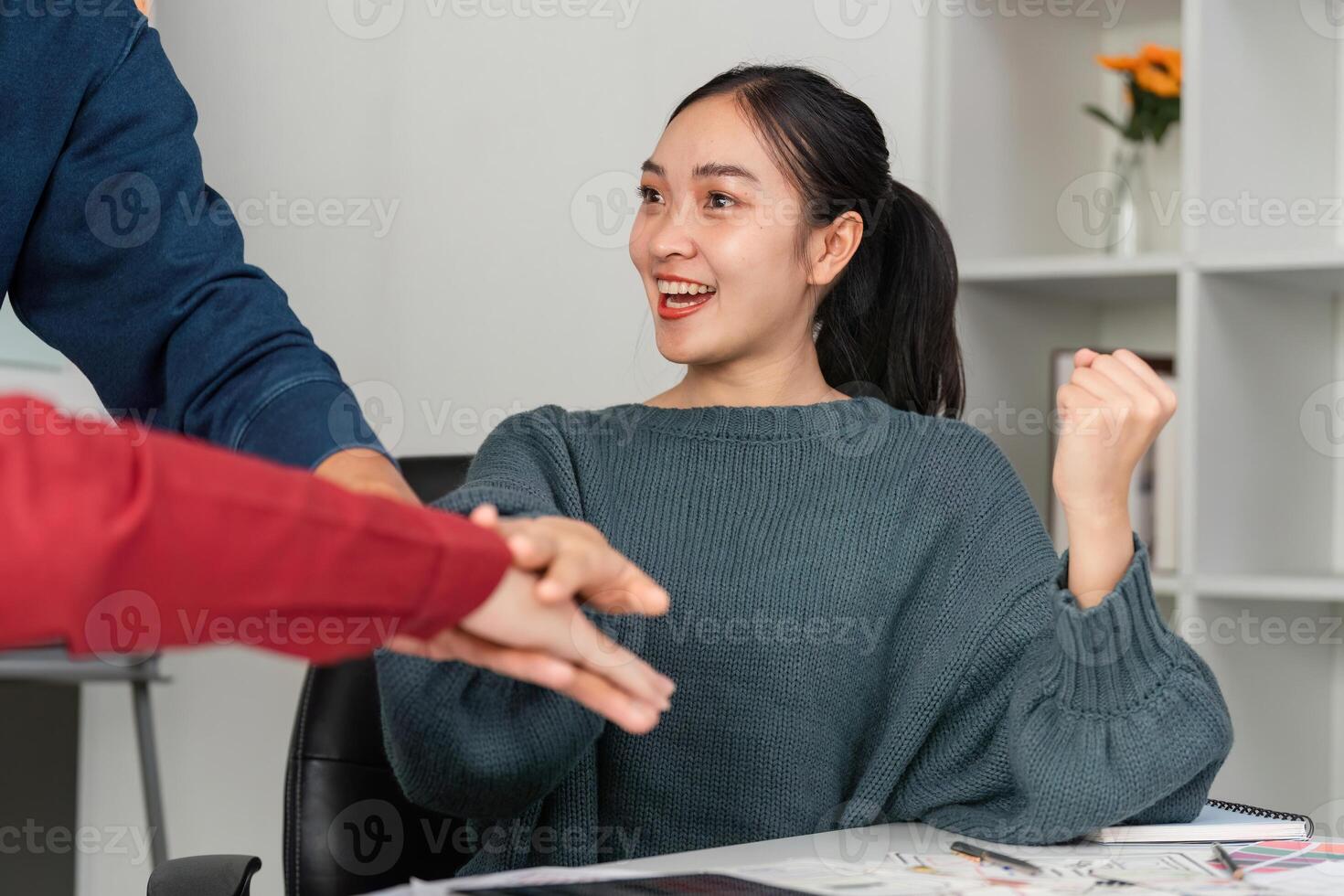 Excitement in Team Dynamics. A team member celebrates a victory during a strategy meeting. photo