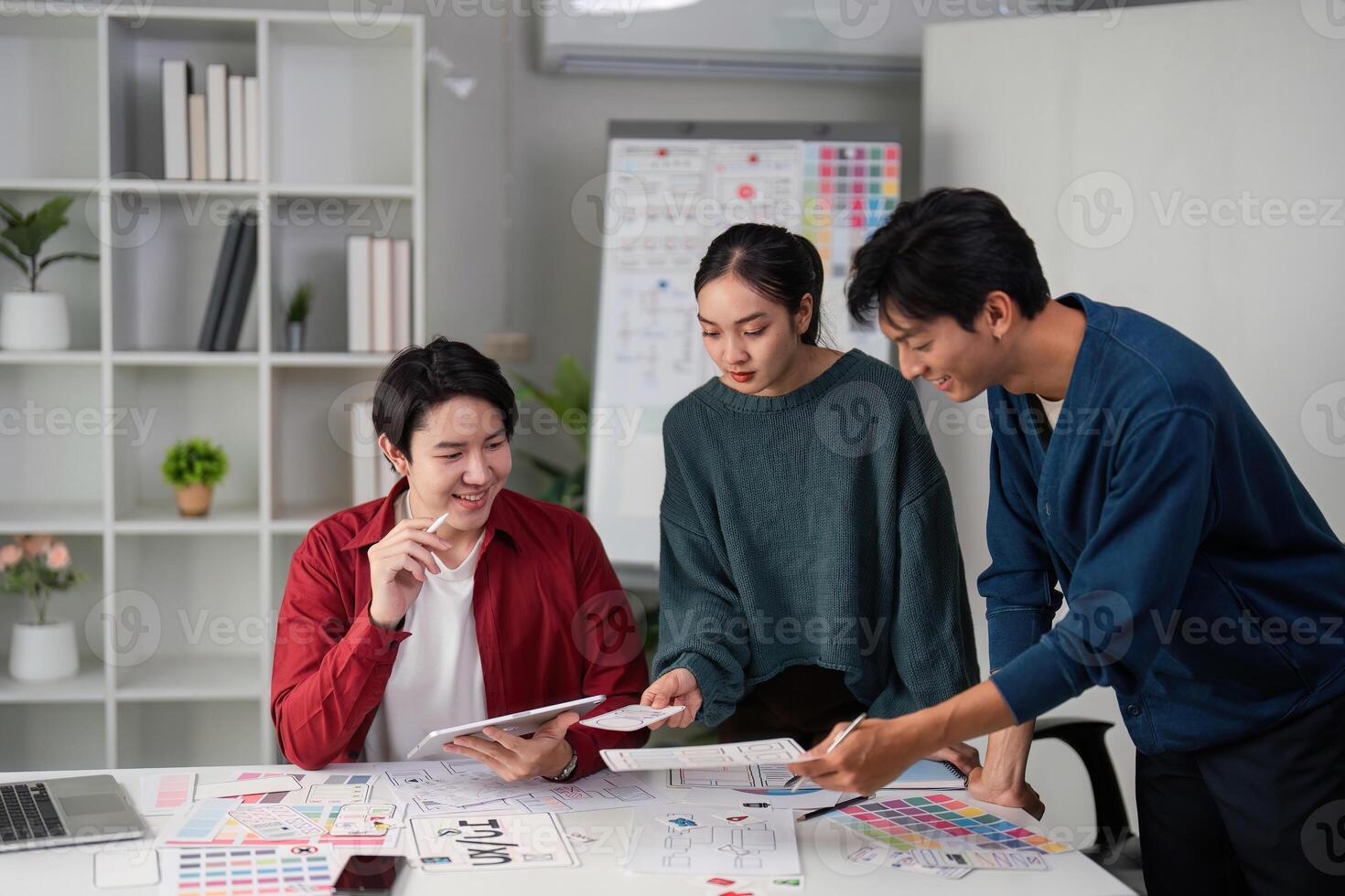 Interactive Design Brainstorming Session. A team engages in lively discussions and sharing ideas for innovative user interface designs. photo