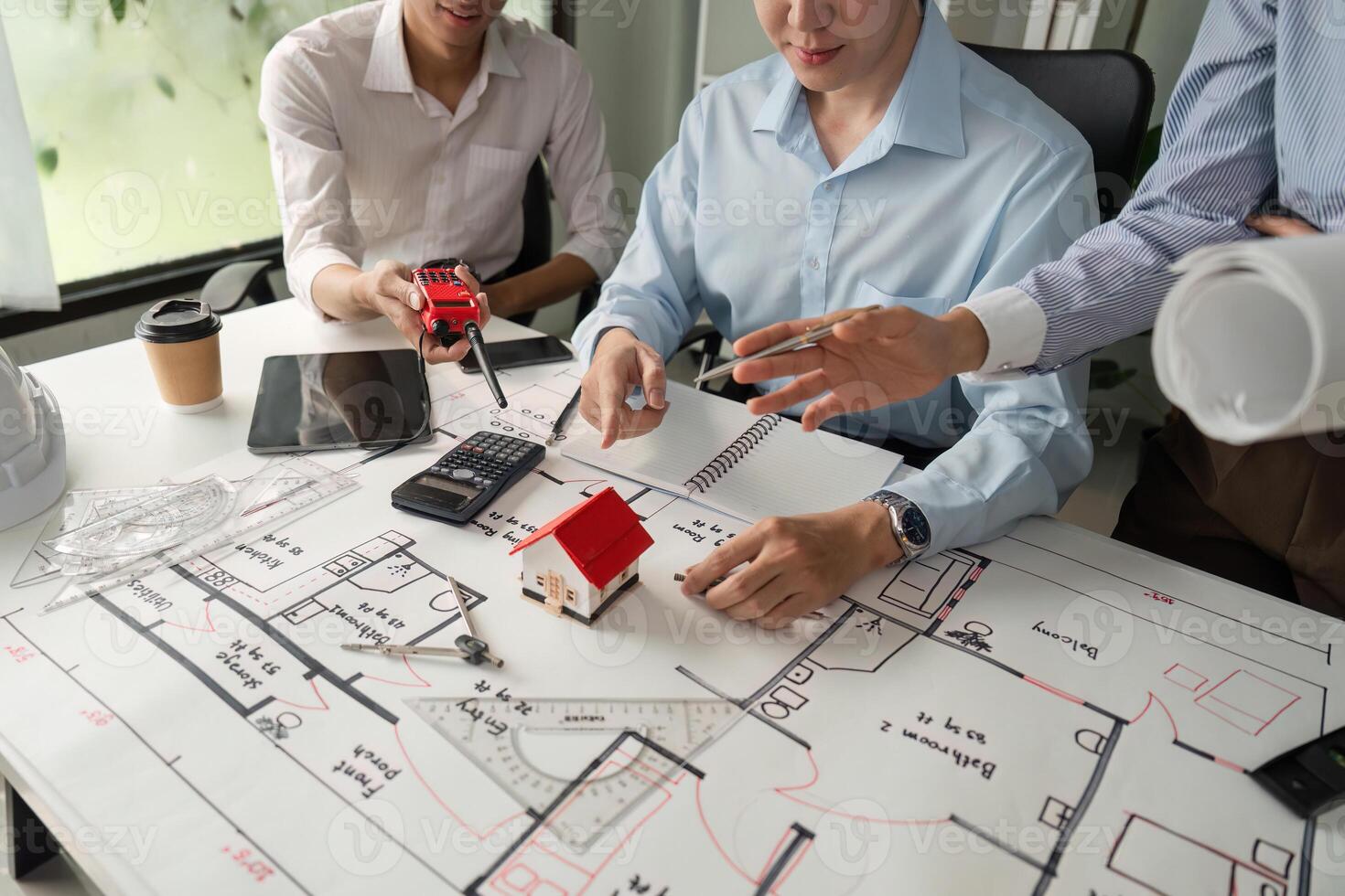 Project Management and Collaboration. Engaging in group discussions over building designs. photo