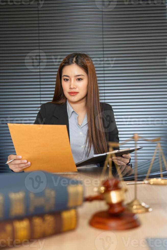 Legal Preparation and Document Review. Attorney analyzing case files in a focused manner. photo