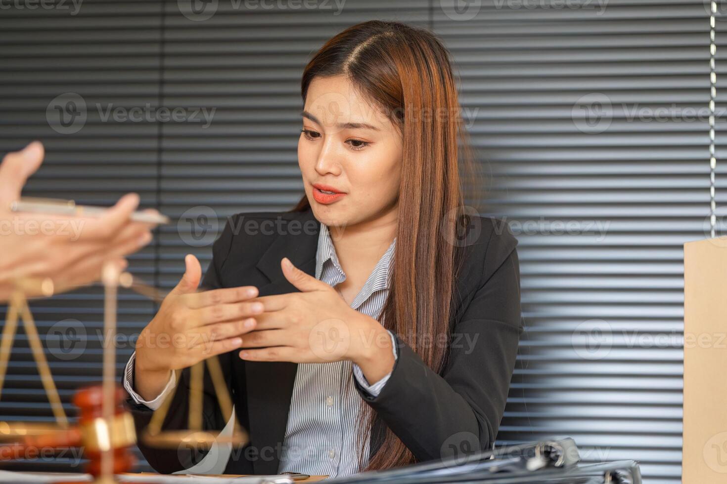 Legal Engagement and Client Discussion. A lawyer presents case arguments to the client with confidence. photo