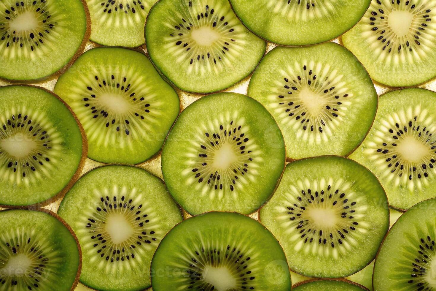 Freshly sliced kiwis arranged artfully, showcasing vibrant green layers and textures photo