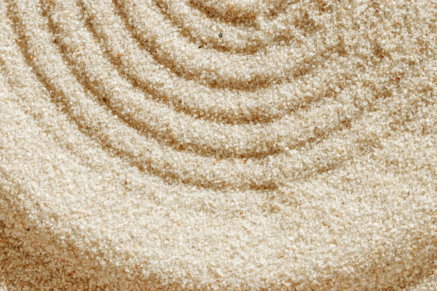 Smooth simple Lines on sand background, minimal aesthetic sandy texture. Spa, meditation, relaxation, wellness concept. Natural beige waves pattern in Japanese zen garden. View from above copy space photo