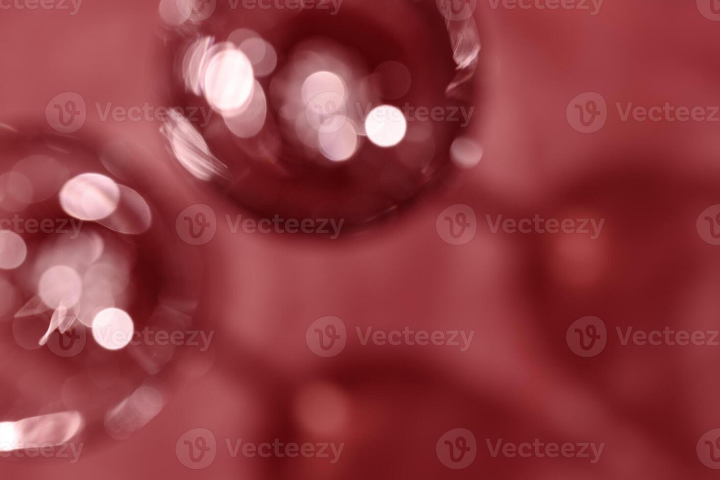 Wine glasses defocused, red wine color blurred background with light flare, optical blur, bokeh. Top view aesthetic still life photo alcoholic drinks art styles for winery, wine list