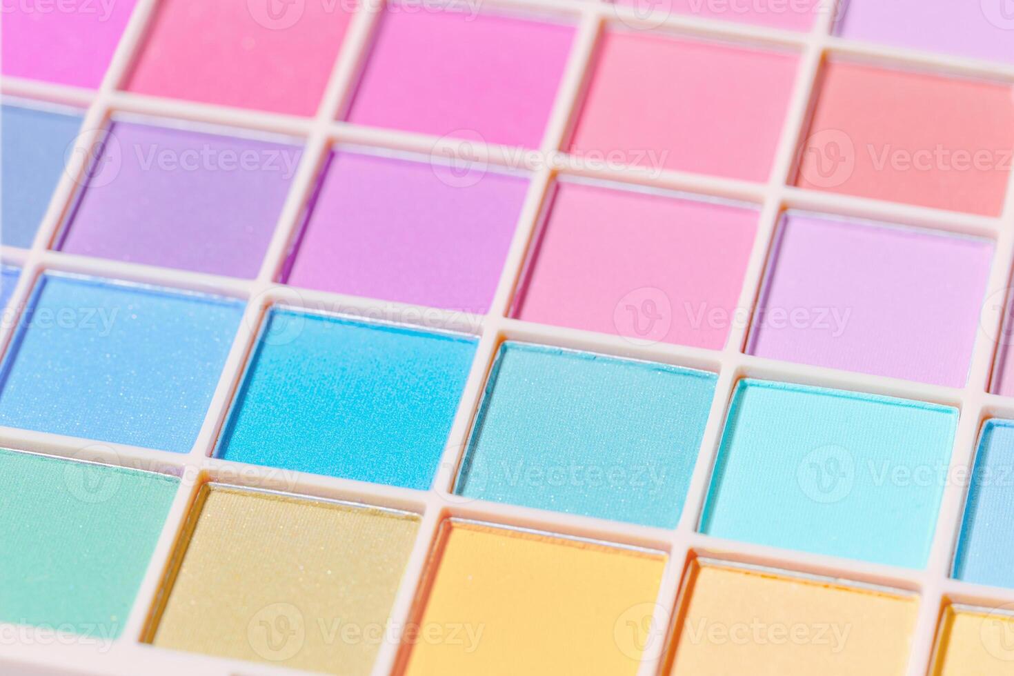 Vivid colored eye shadow makeup palette, pink, violet, blue, pastel colors. Female cosmetic and beauty product, shiny eye shadow, aesthetic texture background, barbie style, selective focus photo