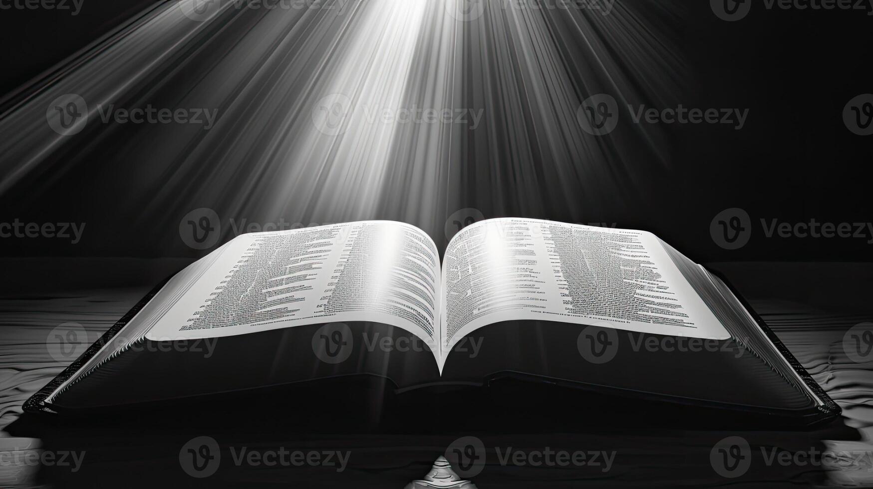 An open bible with rays of light shining through it photo
