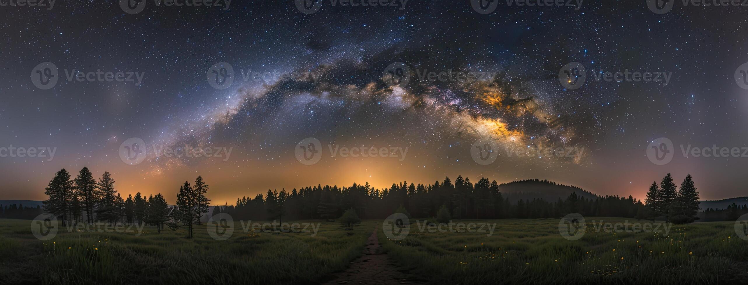 The milky way over the mountains in the night photo