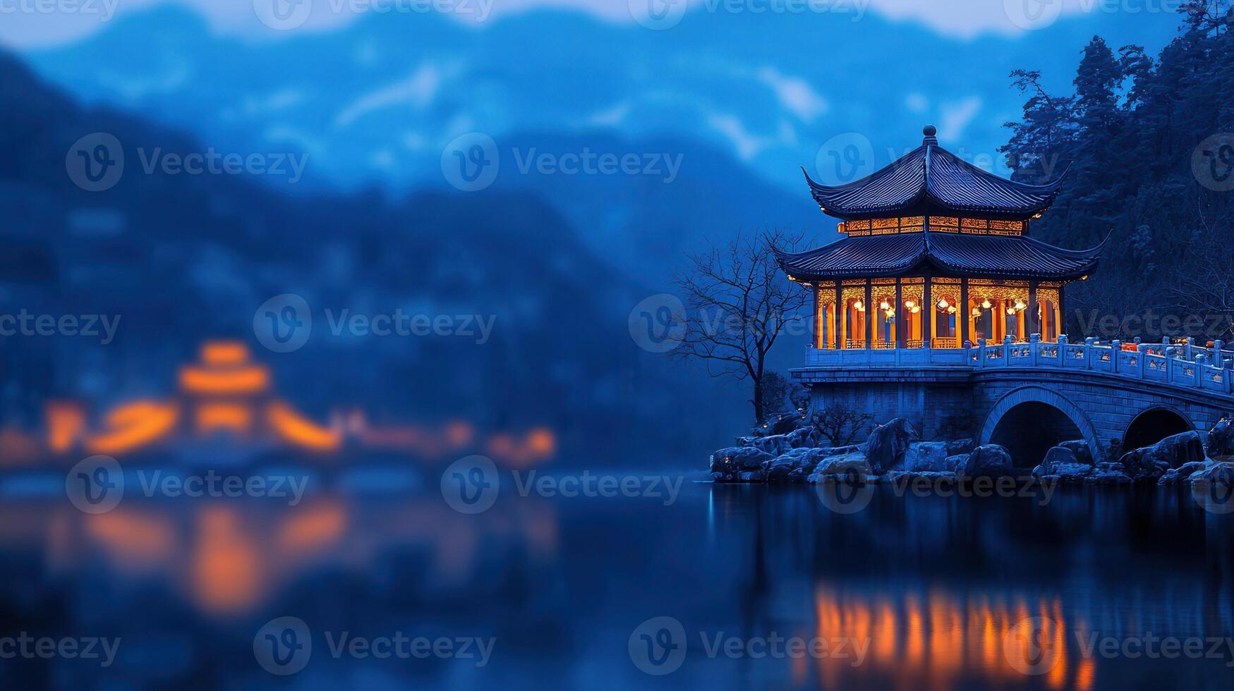 Illuminated Chinese Pavilion on a Tranquil Lake at Dusk Serene Asian Landscape photo