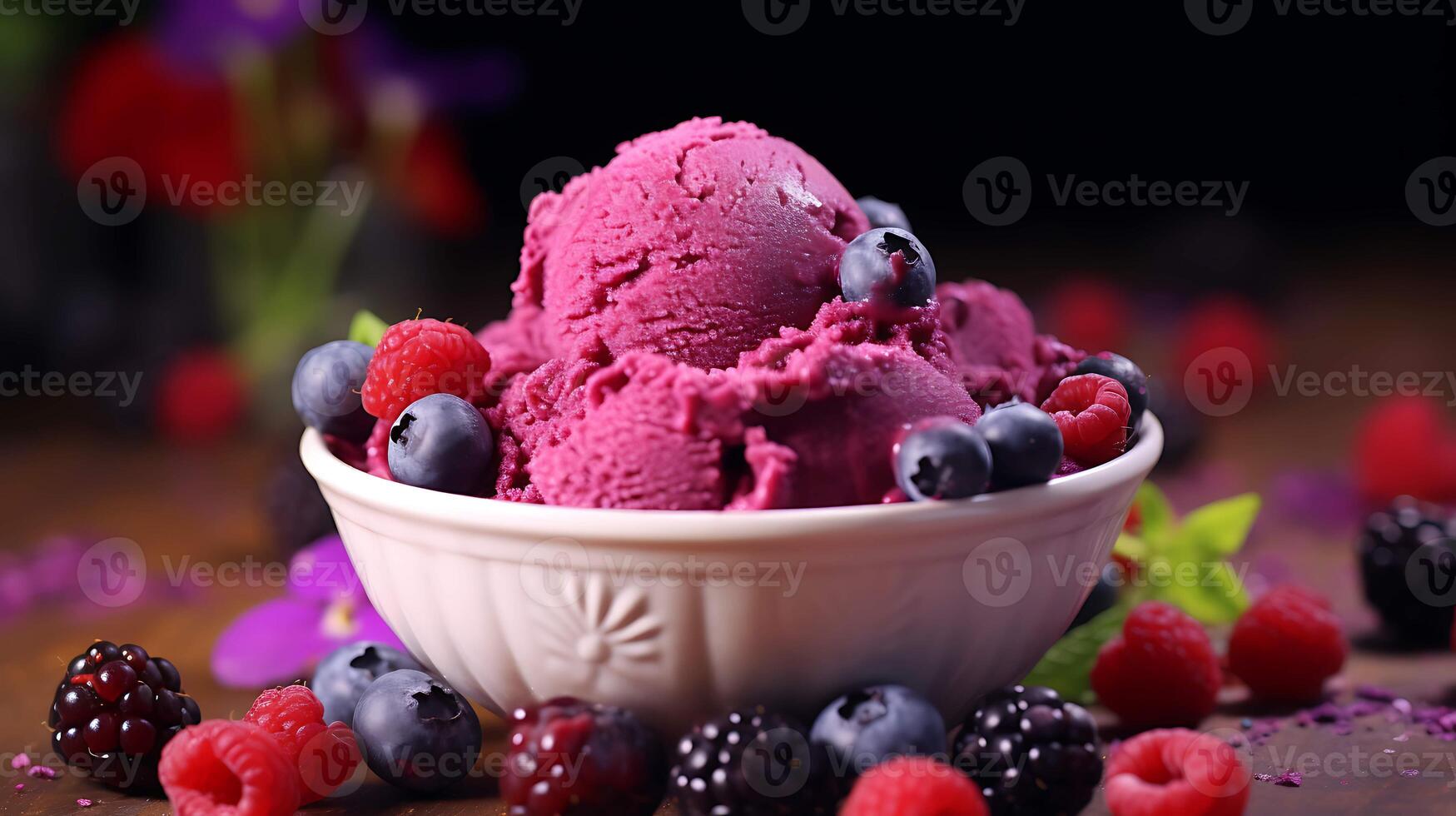 A bowl of ice cream with berries and raspberries photo
