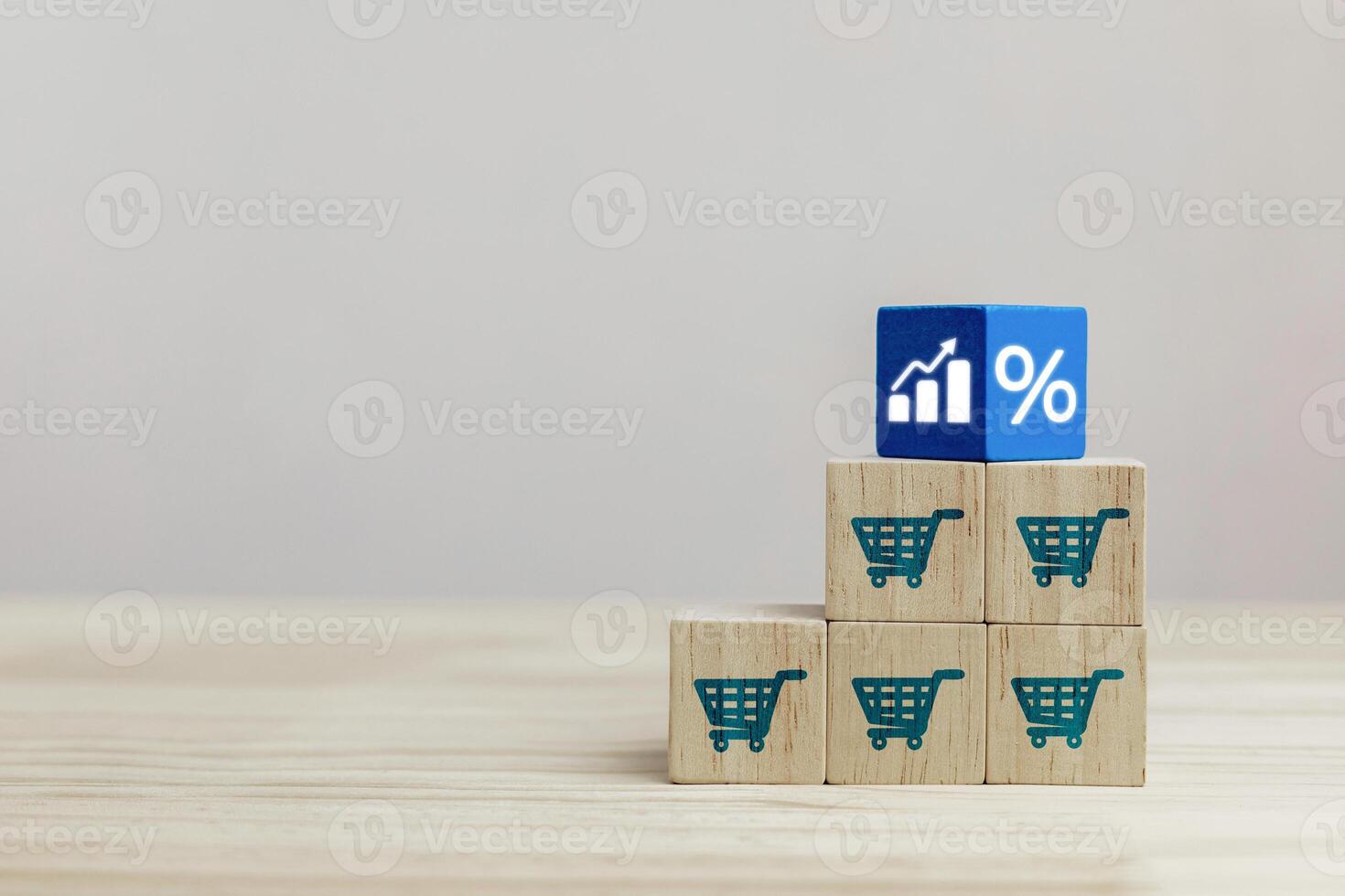 Business growth Concept, Planning marketing strategies to increase sales volume, and e-commerce. Wooden cube with shopping cart icon and increasing graph. photo