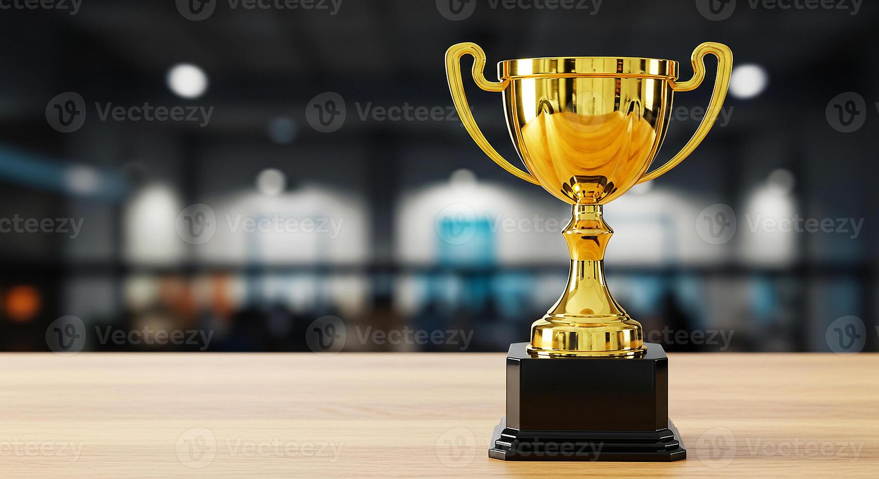 Gold trophy on wooden table with blurred background photo
