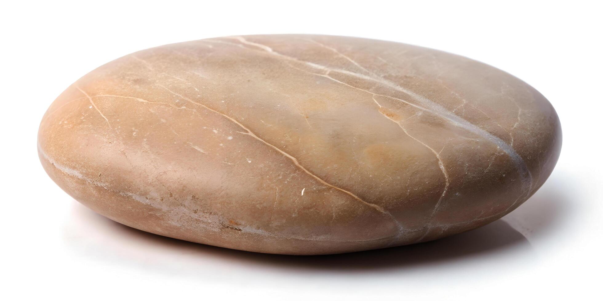 Smooth Tan River Stone with Organic Shape Isolated on White Background in High-Resolution Photography photo