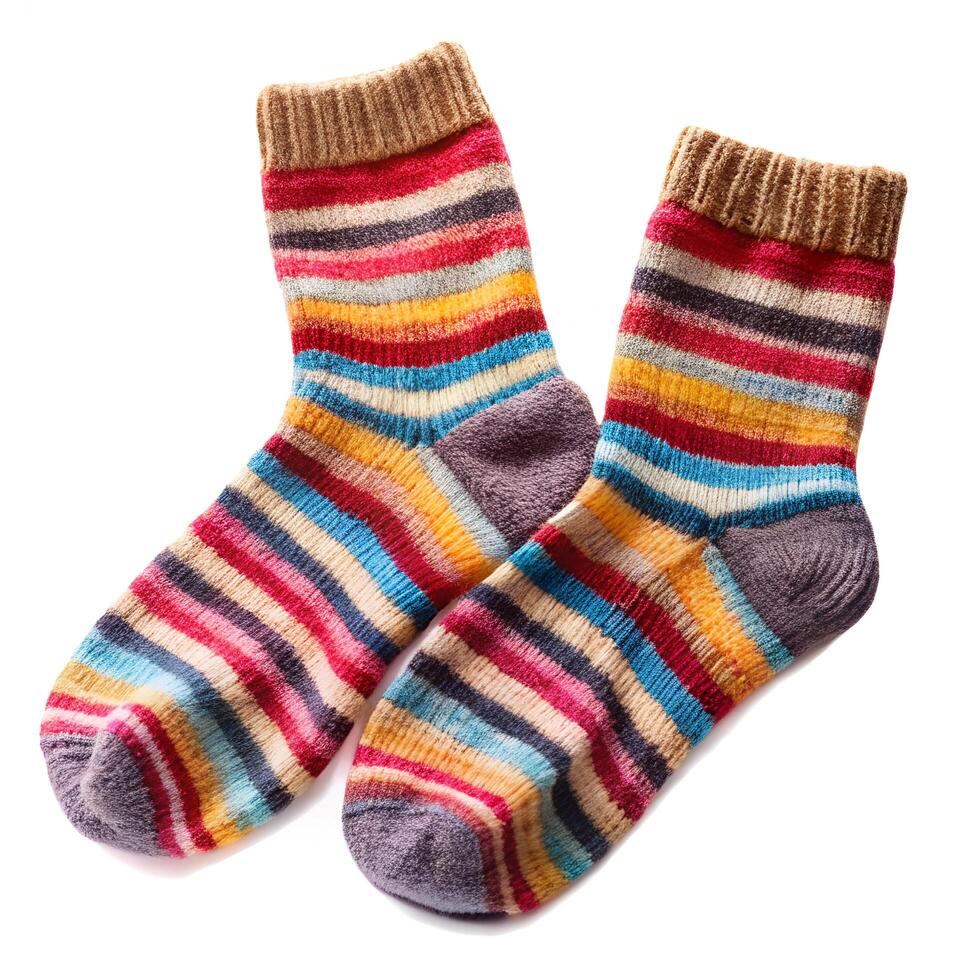 Handmade Knitted Wool Socks with Vibrant Rainbow Stripes Cozy Winter Wear on White Background photo