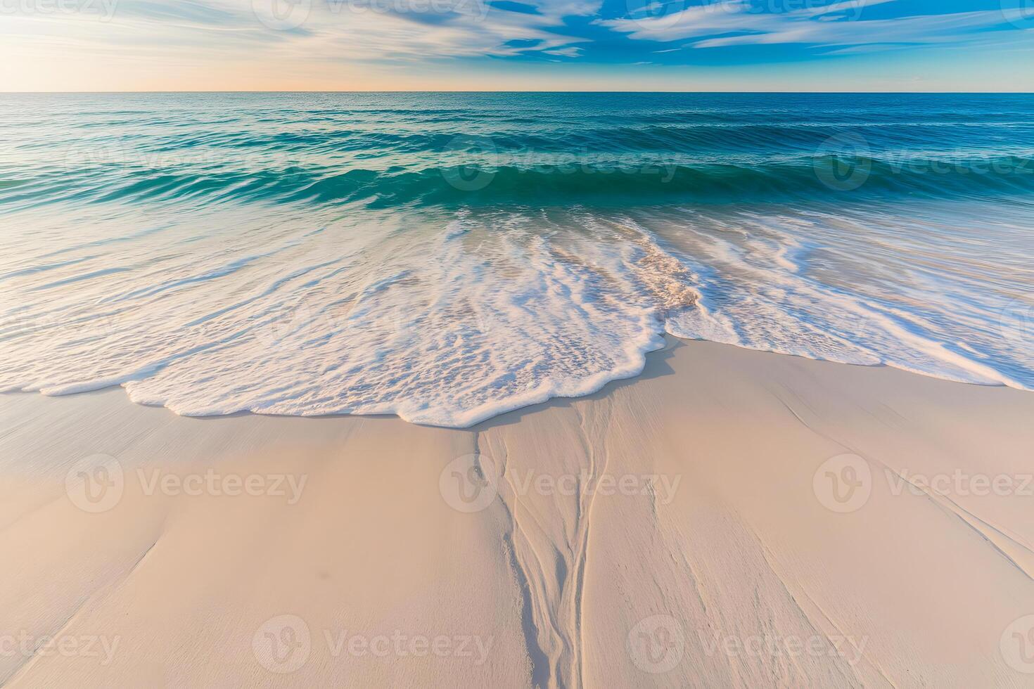 A beach with waves and a sky with clouds photo
