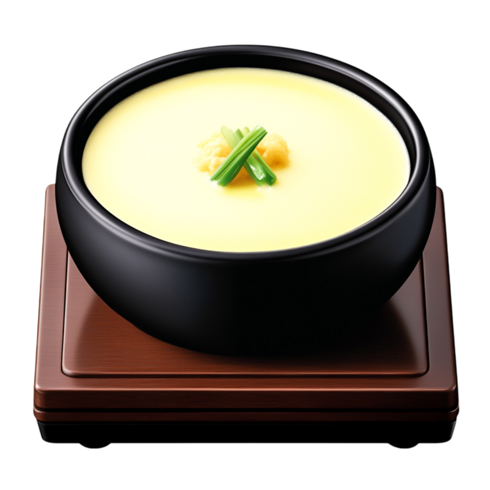 Creamy savory dish in black bowl with green garnish on wooden base png