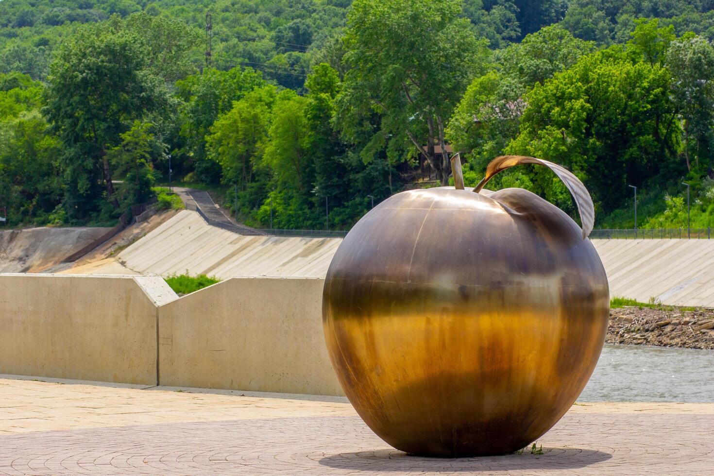 Maykop Russia - 01 June 2024 Bronze apple sculpture as symbol of town photo
