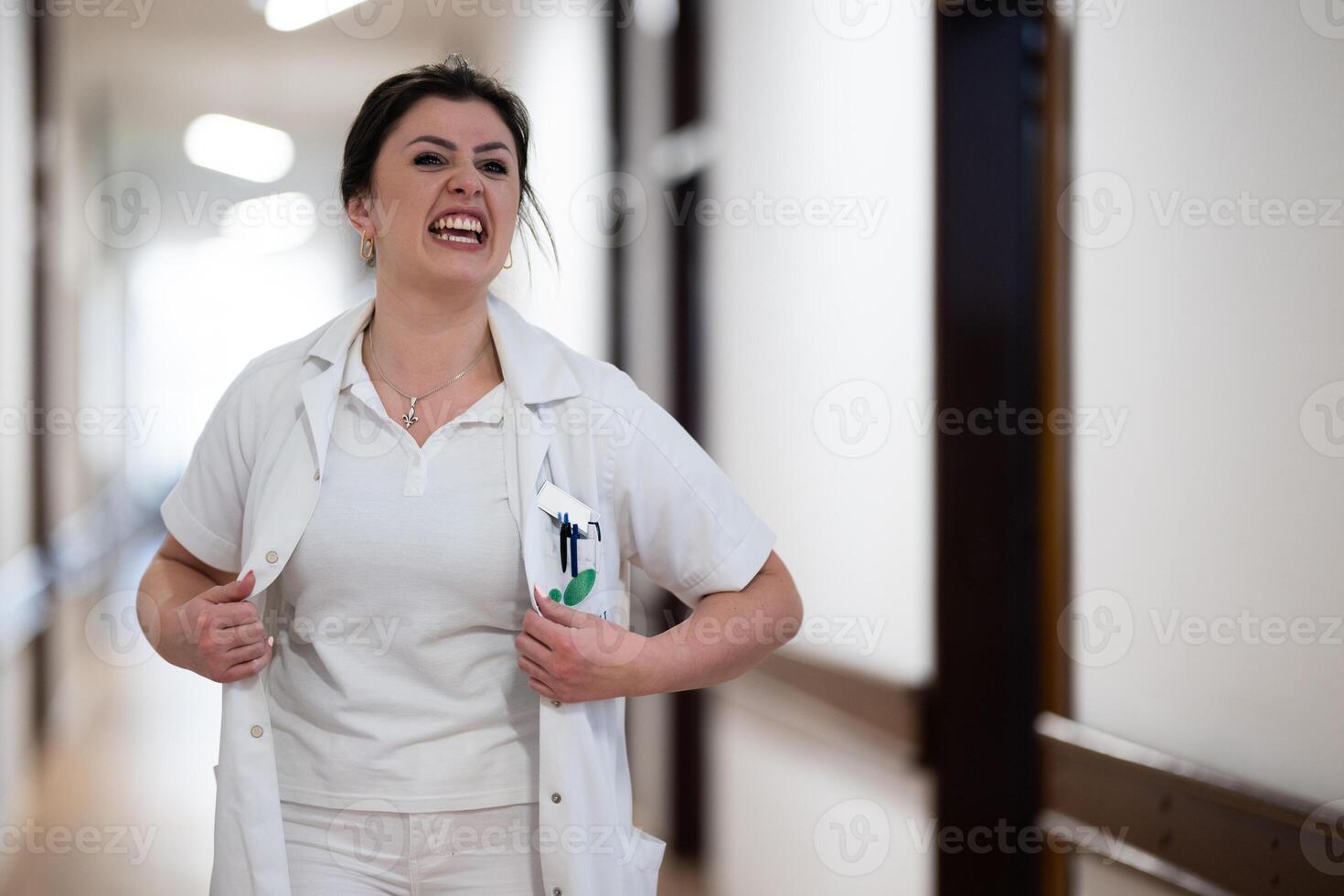Medical personnel, including doctors and nurses, urgently respond in a busy hospital hallway, showcasing their quick action and teamwork in a critical situation photo