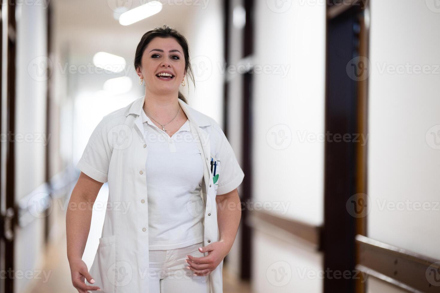 Medical personnel, including doctors and nurses, urgently respond in a busy hospital hallway, showcasing their quick action and teamwork in a critical situation photo