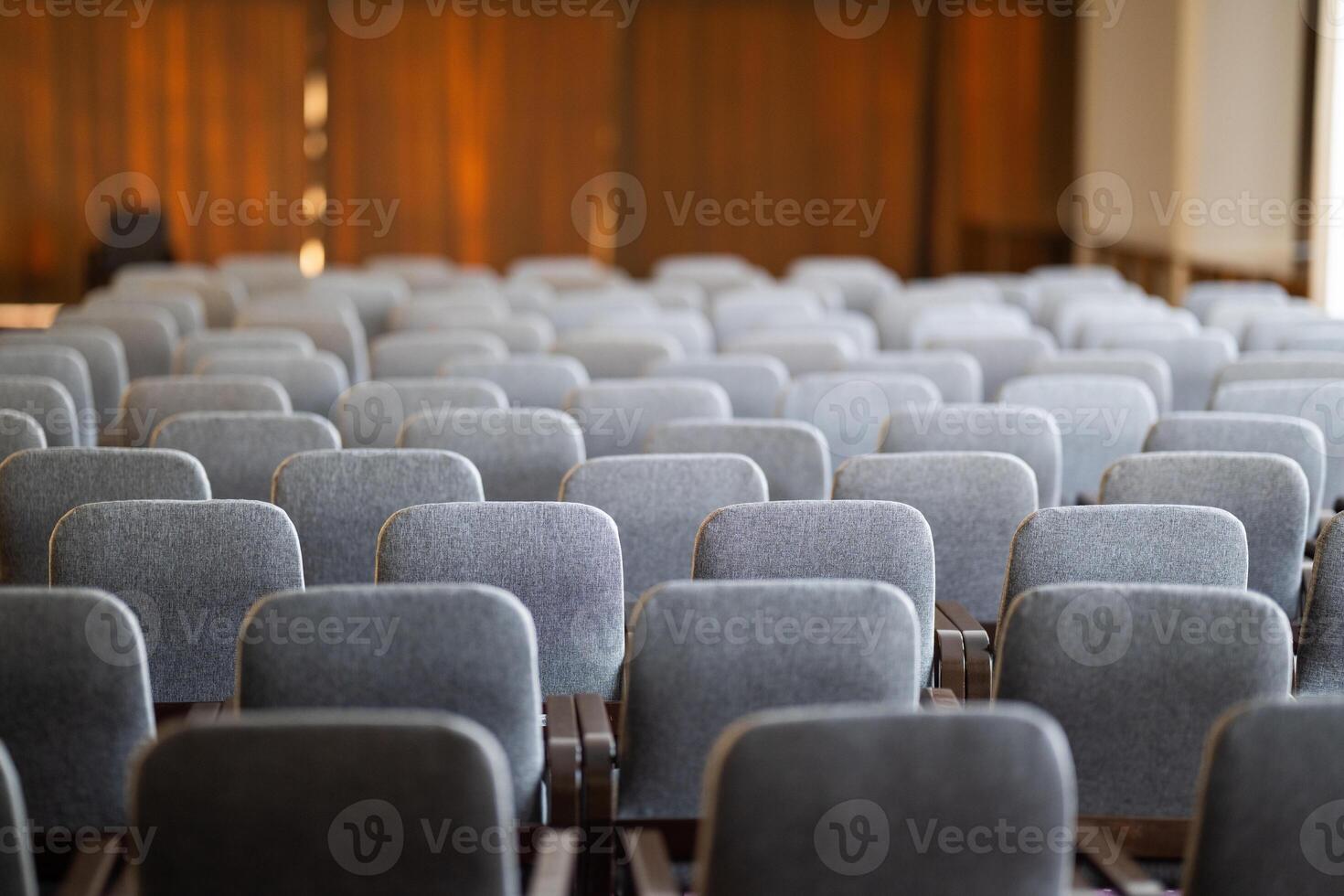 Empty Conference Hall with Rows of Chairs photo