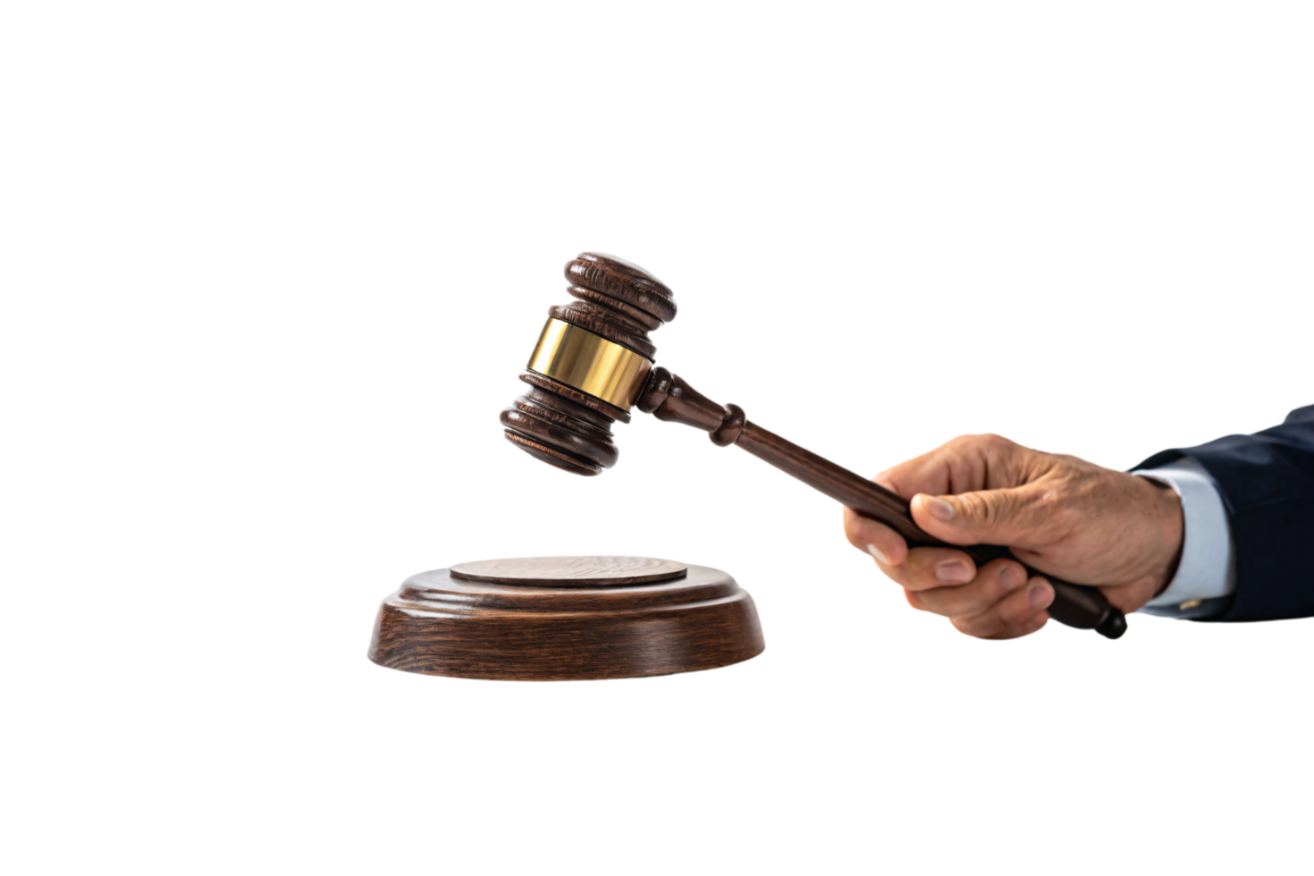 A judge's hand raises a gavel over a wooden base, symbolizing authority, judgment, and the process of delivering justice in the courtroom png