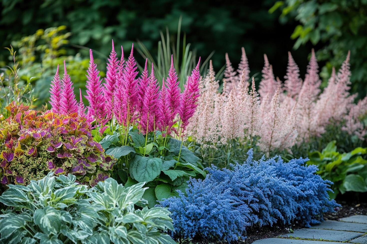 Flowerbed with beautiful flowers and greenery in the front yard of a country house. Example of landscape design. photo