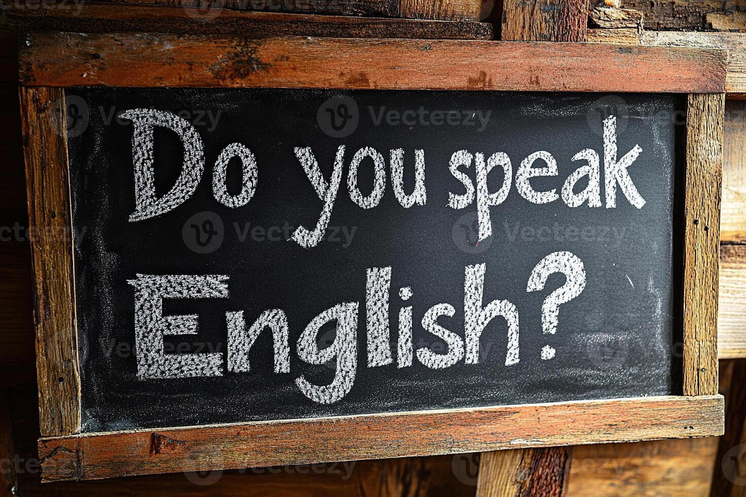 A board with the text Do you speak English written on it in white chalk. Concept of learning English photo