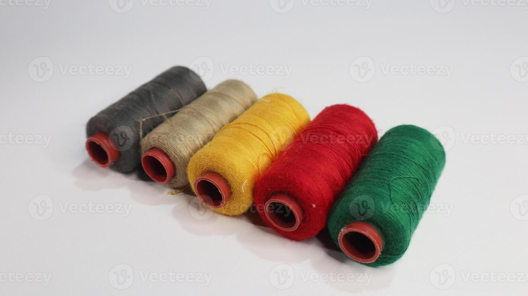 colorful sewing thread Benang Jahit on photo