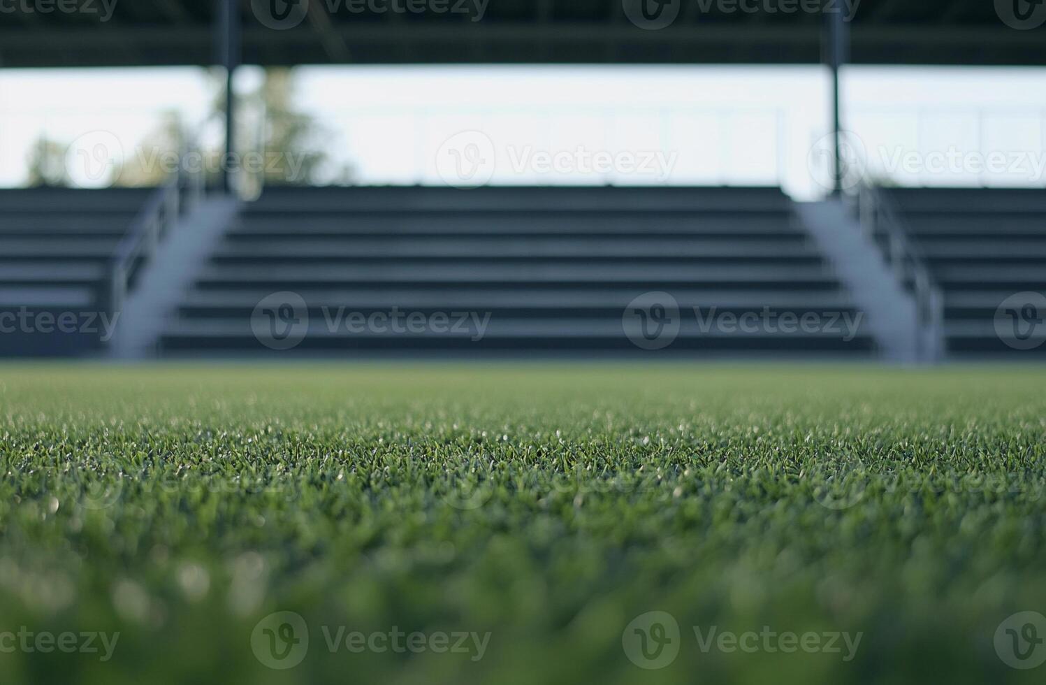 A panoramic view of a football field with bright green turf and white boundary lines. The wide-open space is perfect for sports-themed visuals, teamwork concepts, and dynamic action shots photo