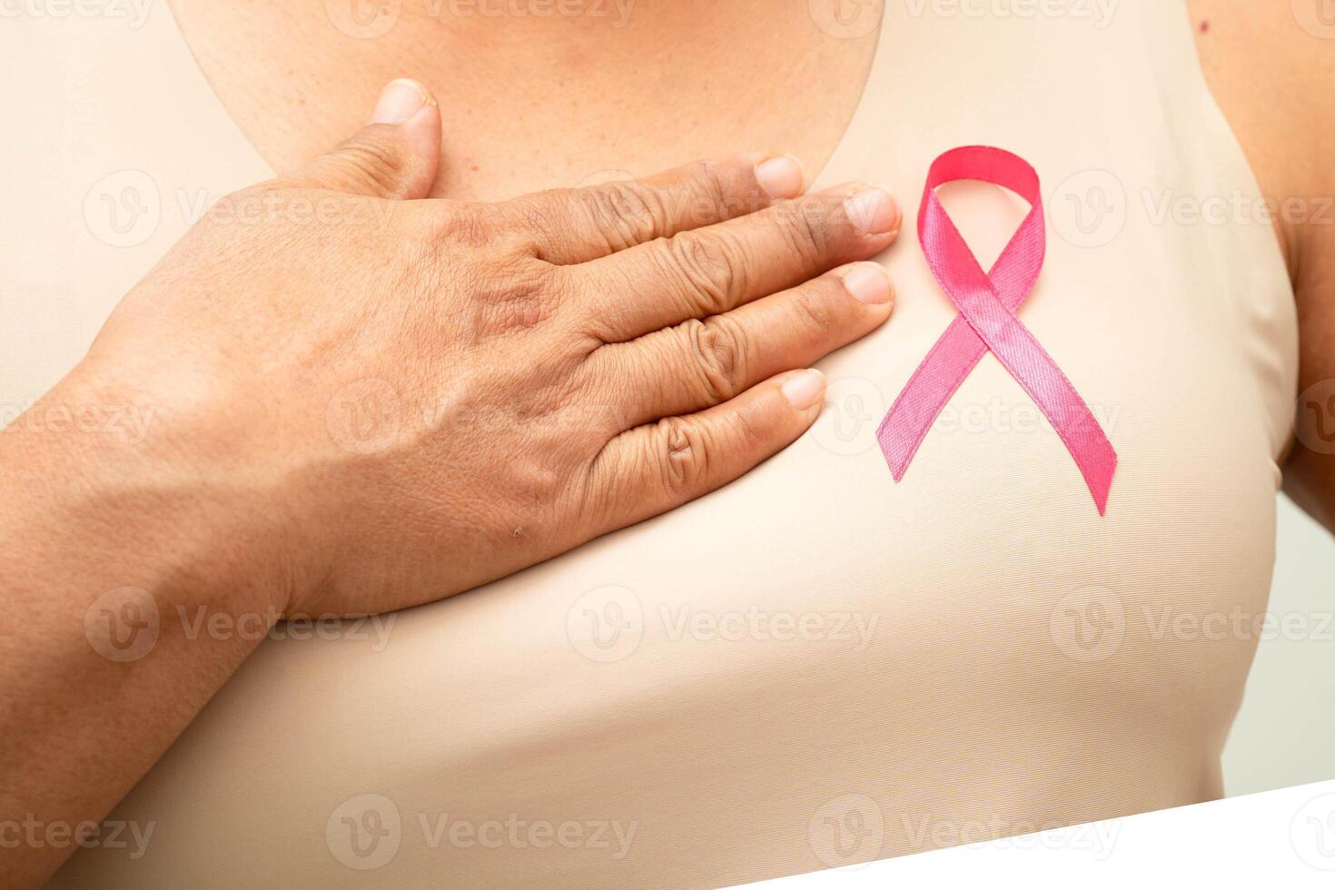 Asian woman with pink ribbon for October world breast cance photo