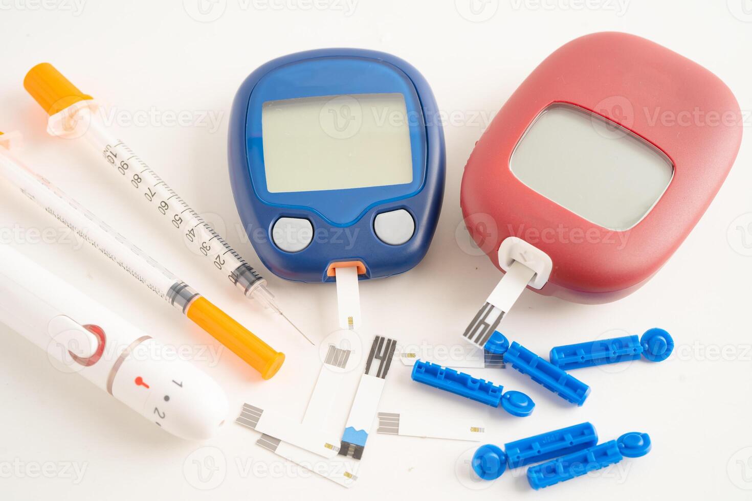 Glucometer lancet and test stick measuring human blood sugar level for diabetes. photo