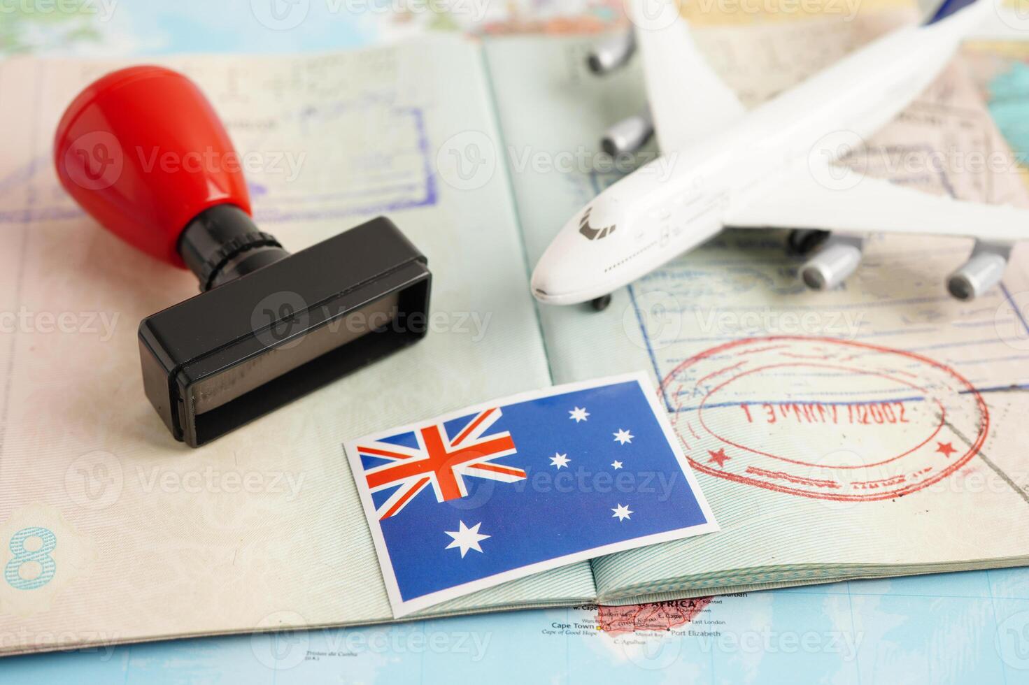 Australia flag and passport with airplane for travel. photo
