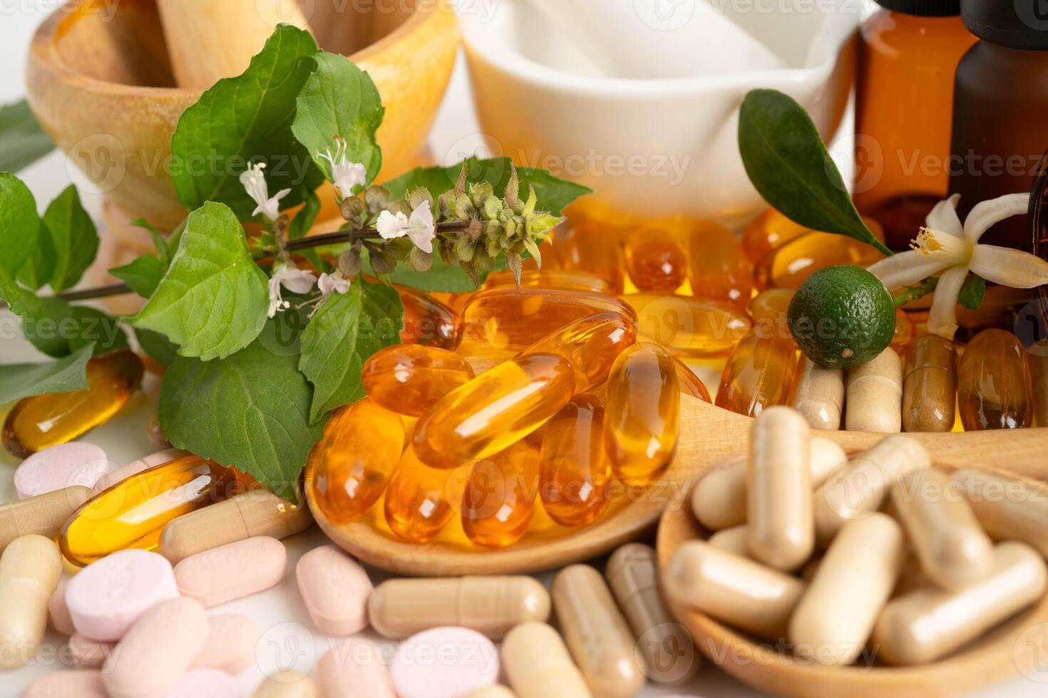 Alternative medicine herbal organic capsule with vitamin E omega 3 fish oil, mineral, drug with herbs leaf natural supplements for photo