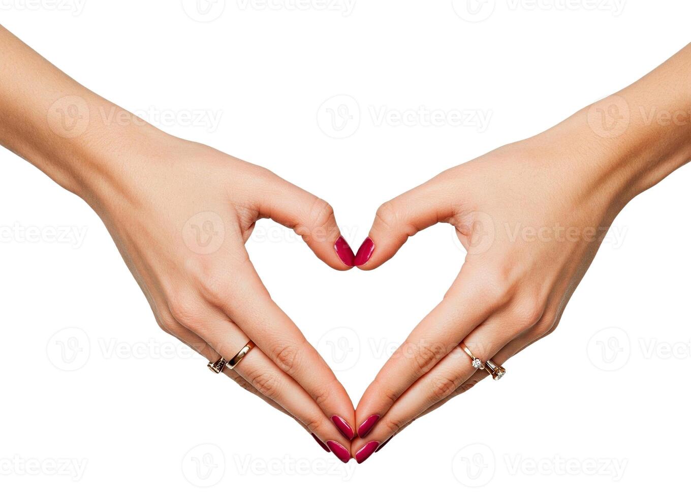 Delicate female hands, adorned with jewelry, forming a heart shape isolated on white background photo