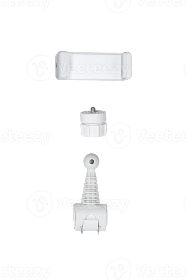 A disassembled phone holder featuring three components a clamp, a screw connector, and a base with a ball joint, isolated on a plain white back photo