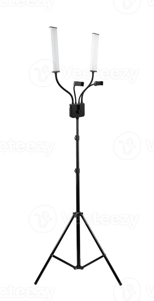 Dual LED light setup on a tripod stand with adjustable arms and a central control unit, offering bright, energy-efficient illumination, isolated on white. photo