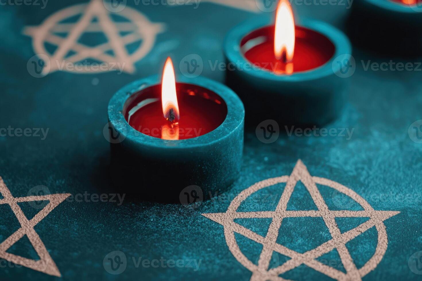 Candles burning on a mystical table with pentagram symbols, evoking a spiritual atmosphere. photo