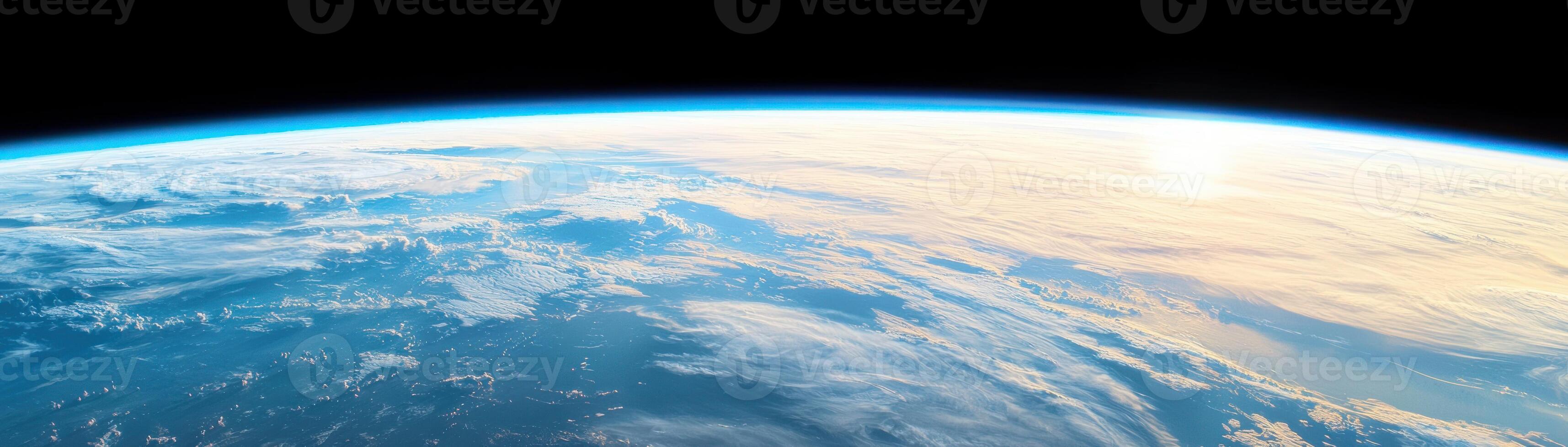 A breathtaking view of Earth from space, showcasing clouds and ocean curves. photo