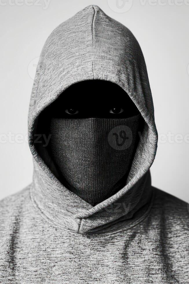 Mysterious figure in a hoodie, embodying anonymity and intrigue. photo
