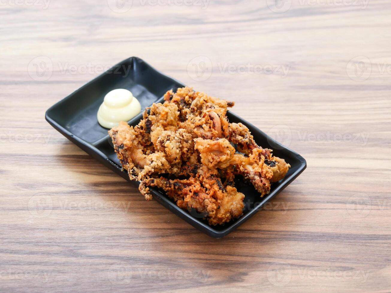 Ika Geso Karaage or Fried Squid Tentacles with Mayonnaise served in tray dish isolated on table side view of Japanese food photo