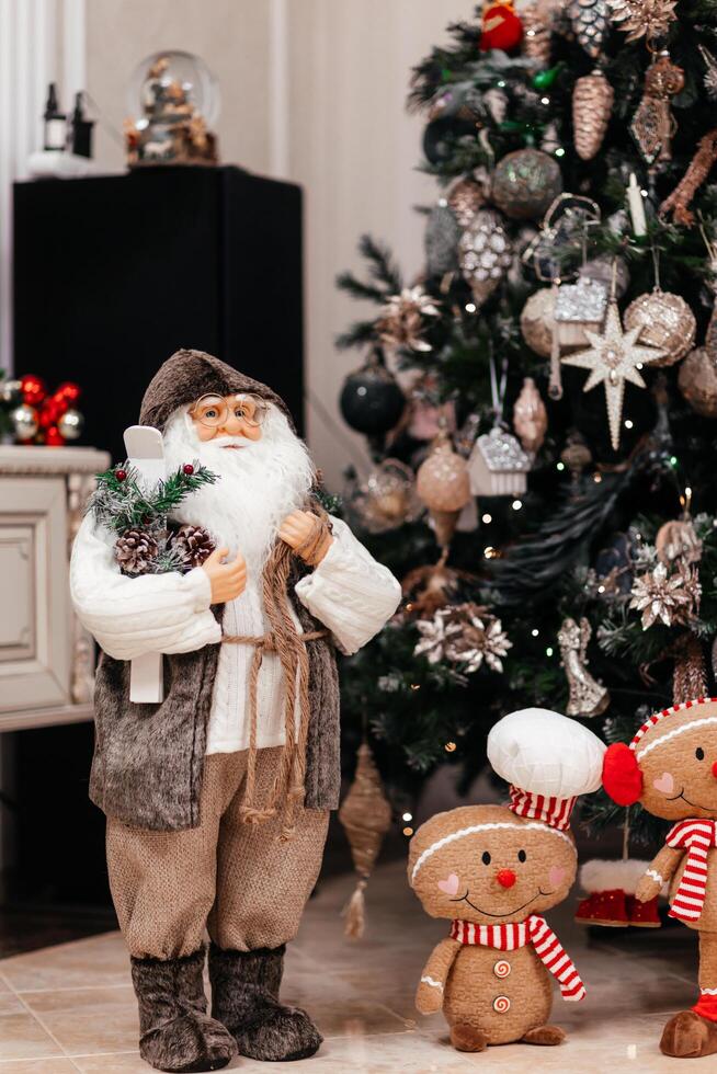 Christmas Tree with Gifts and Toys Decor for New Year. Santa figures, wreaths, and other holiday decorations. The vibrant display creates cheerful and traditional holiday atmosphere photo