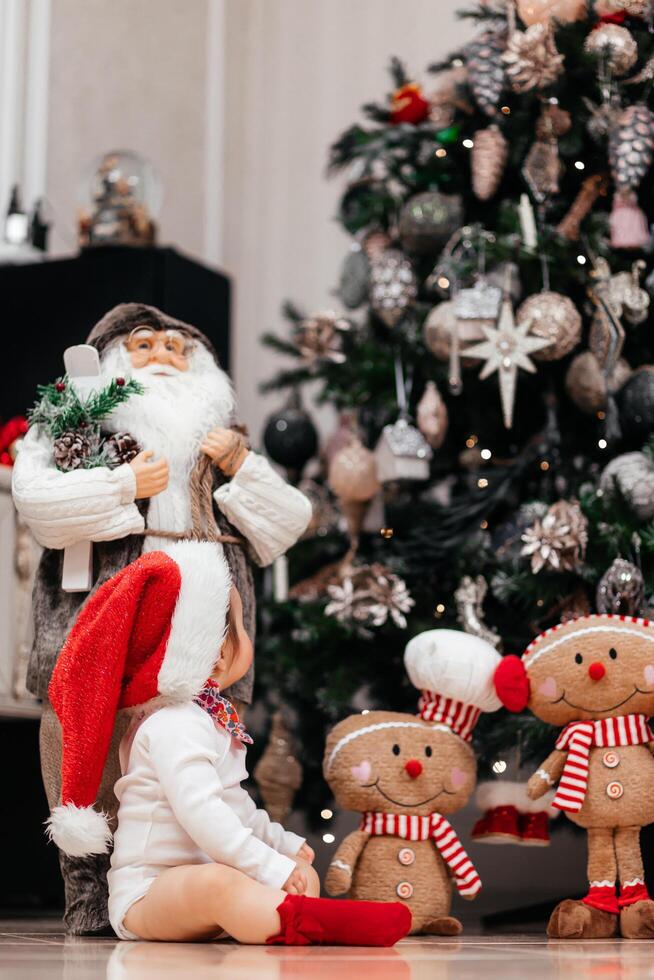 Christmas Tree with Santa and Toys Decor for New Year. Holiday decorations at home. The vibrant display creates cheerful and traditional holiday atmosphere. Vertical photo