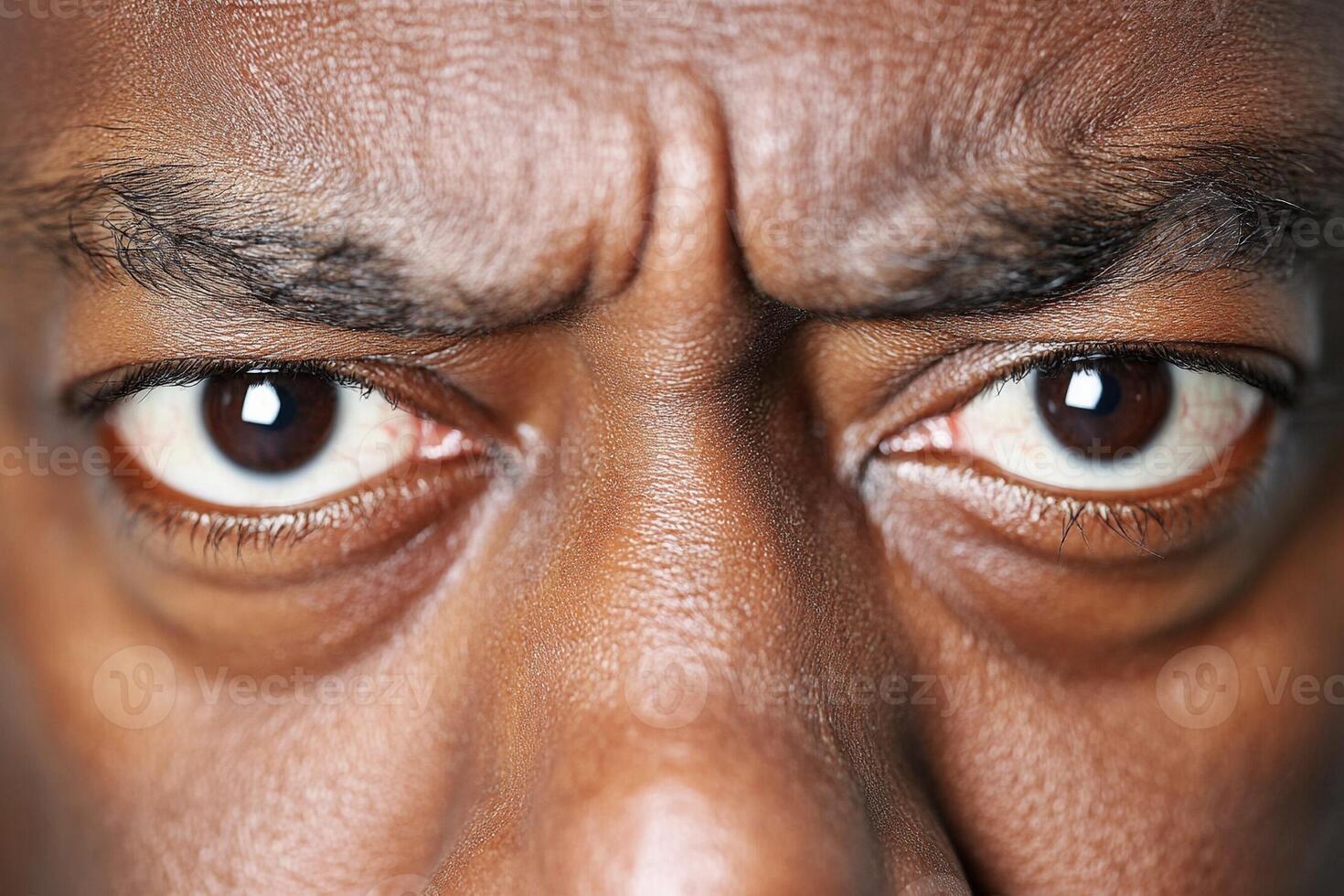 A close up of a man's face with a big frown photo