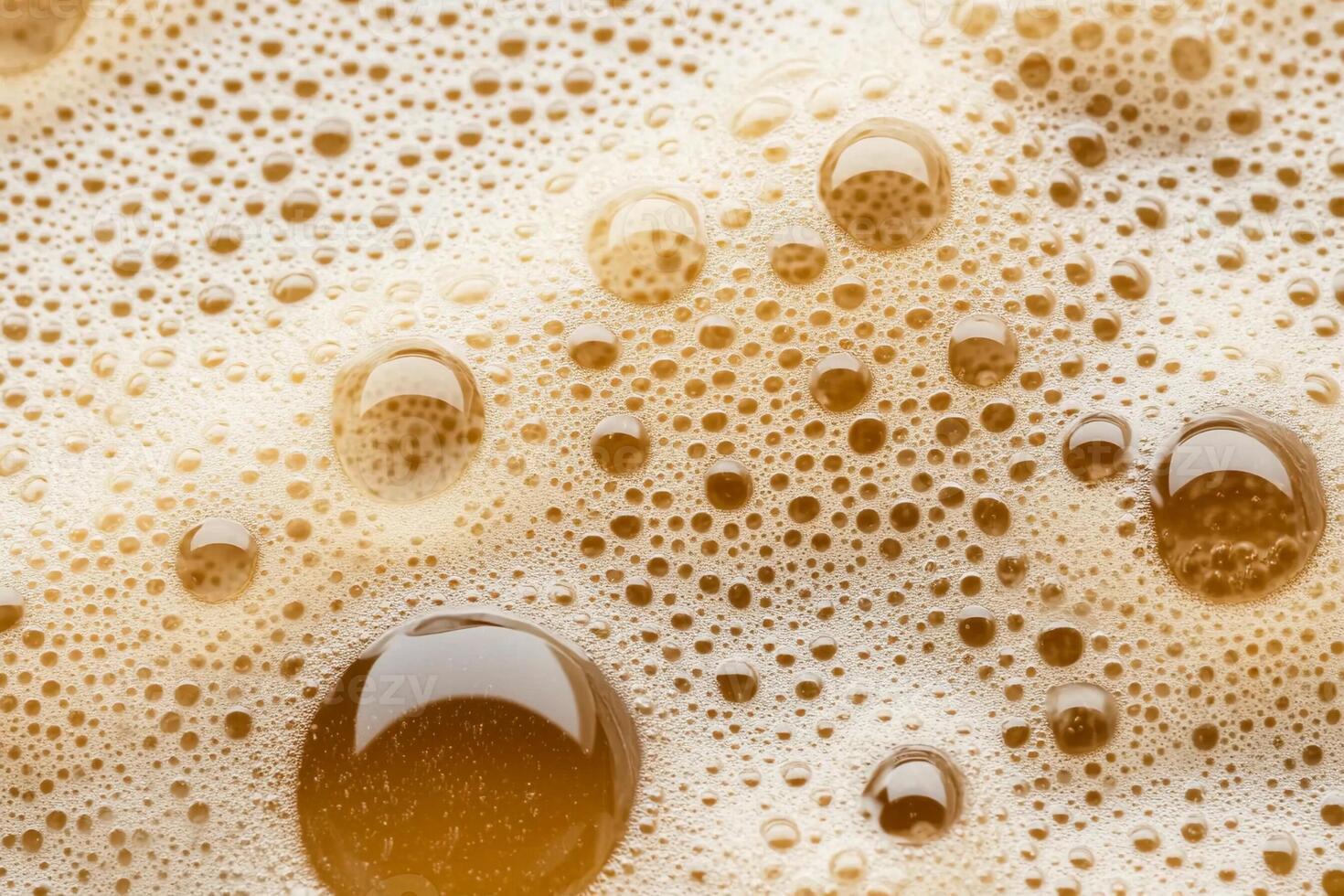 A close up of a glass of beer with bubbles photo