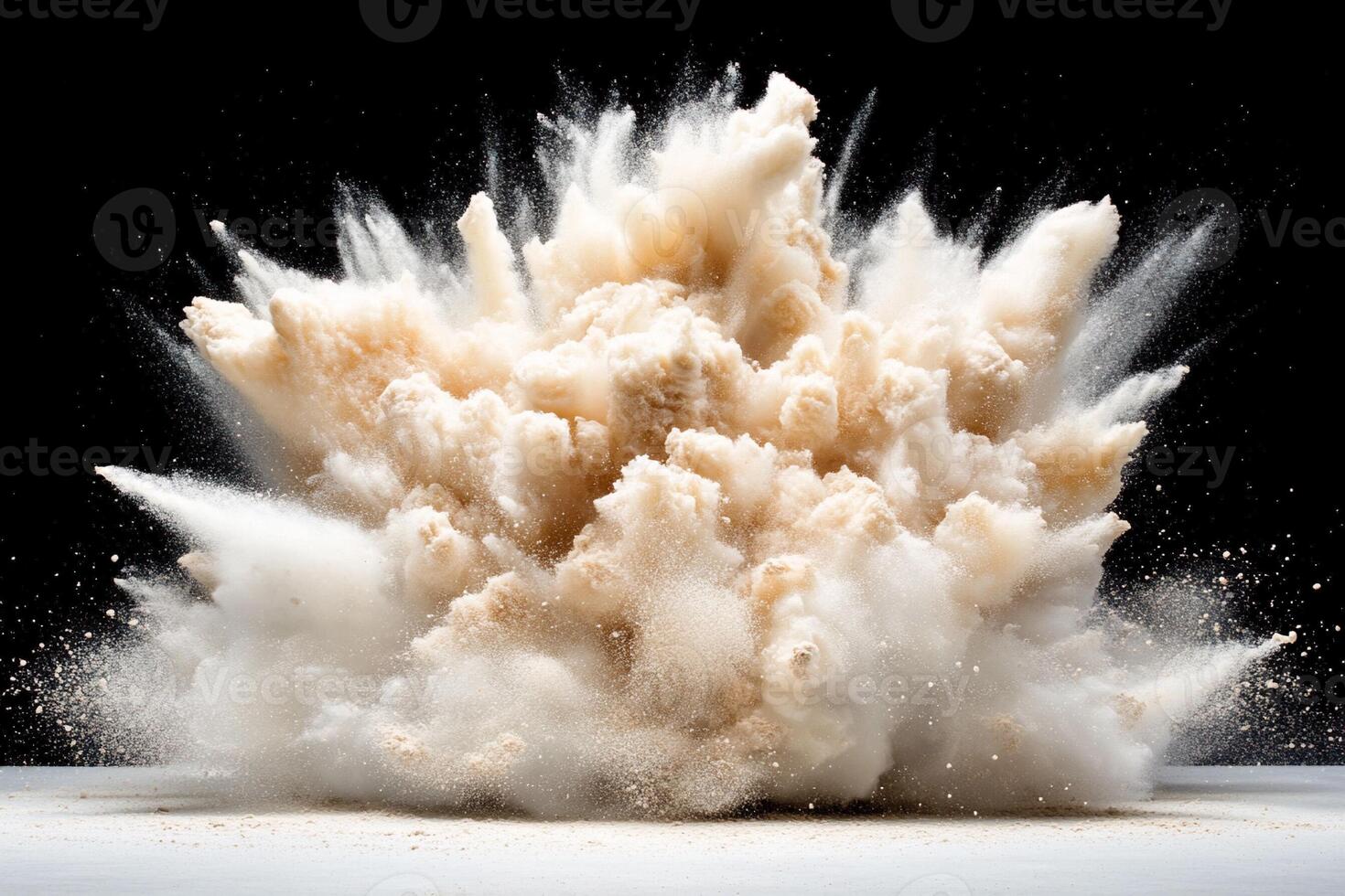 A large explosion of white powder on a black background photo