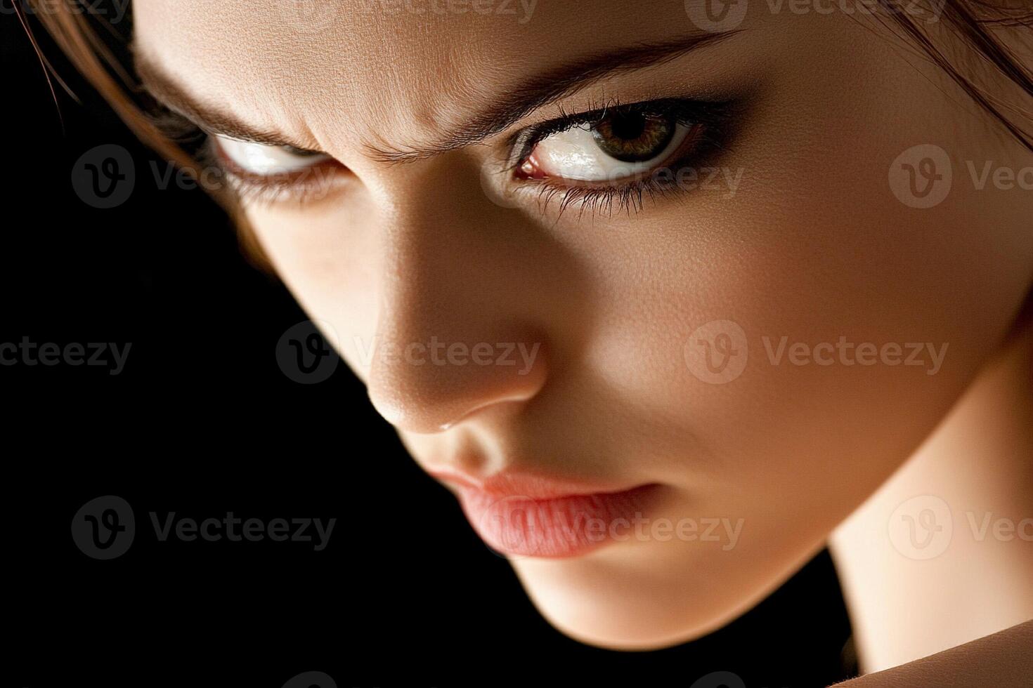 A close up of a woman with a very angry face photo