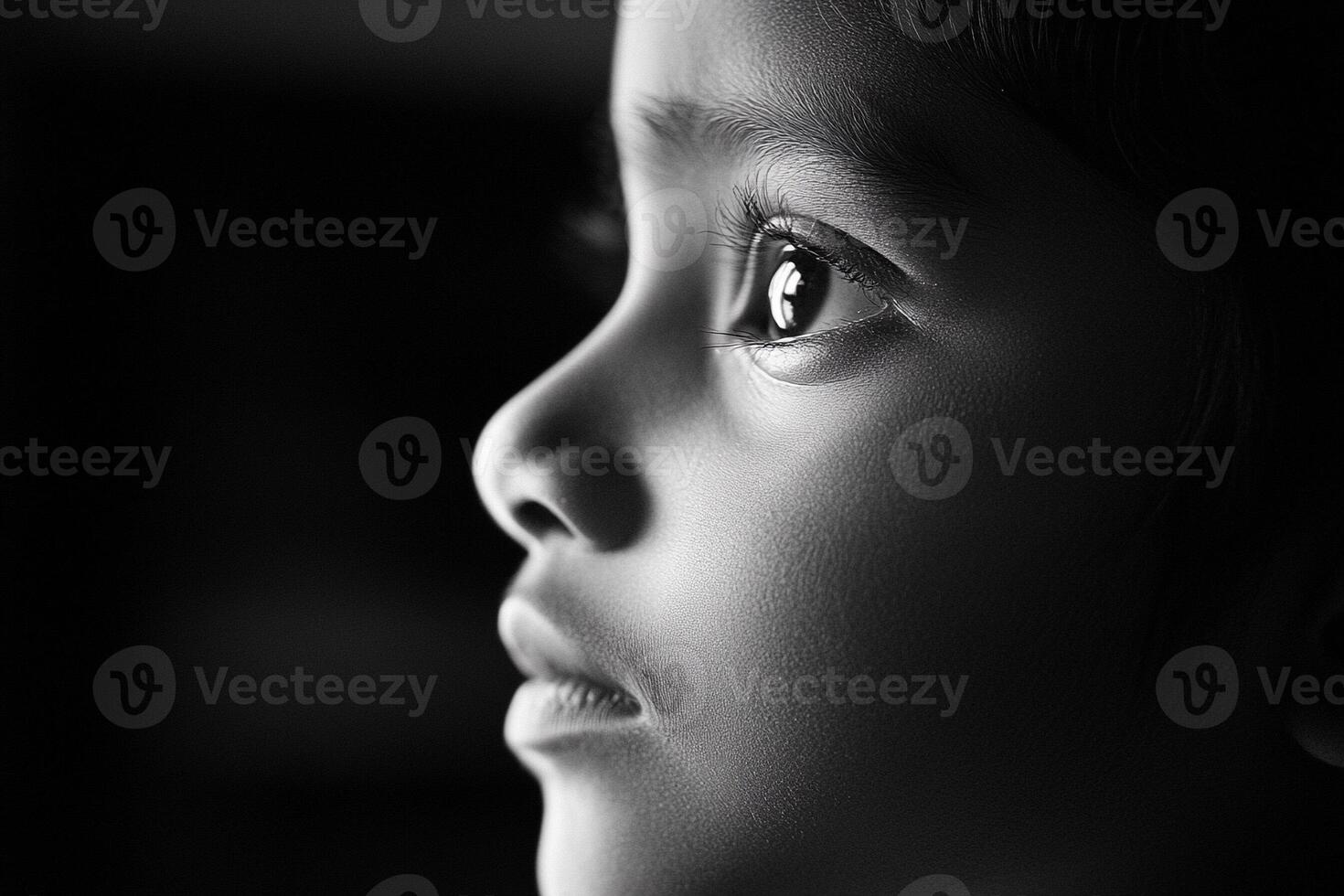 A black and white photo of a child's face