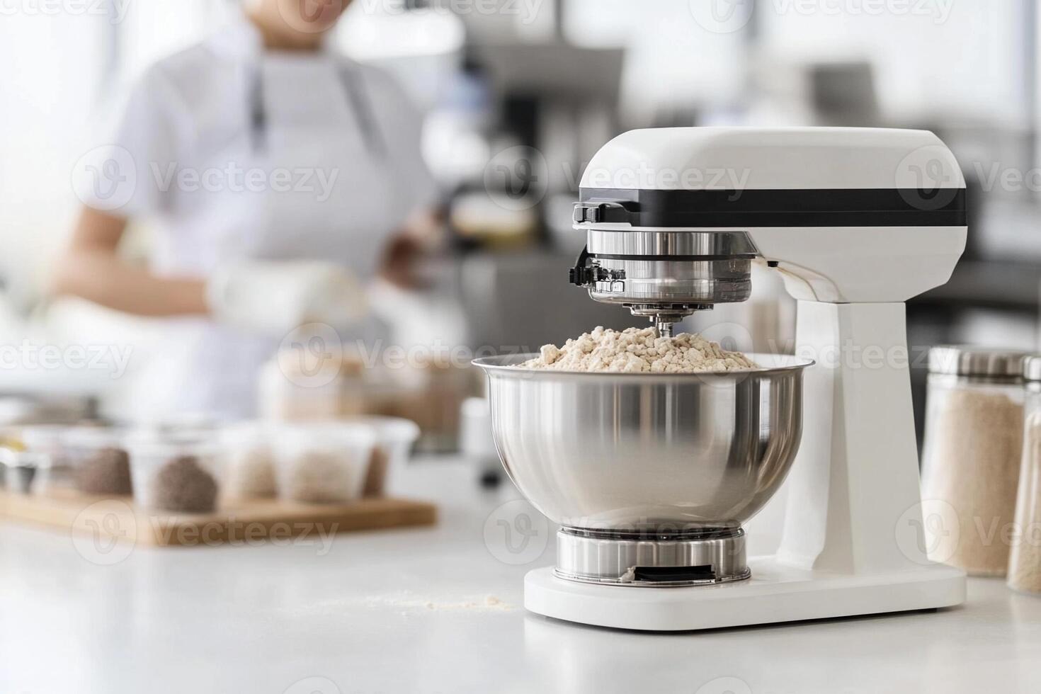 A woman is mixing ingredients in a kitchen photo