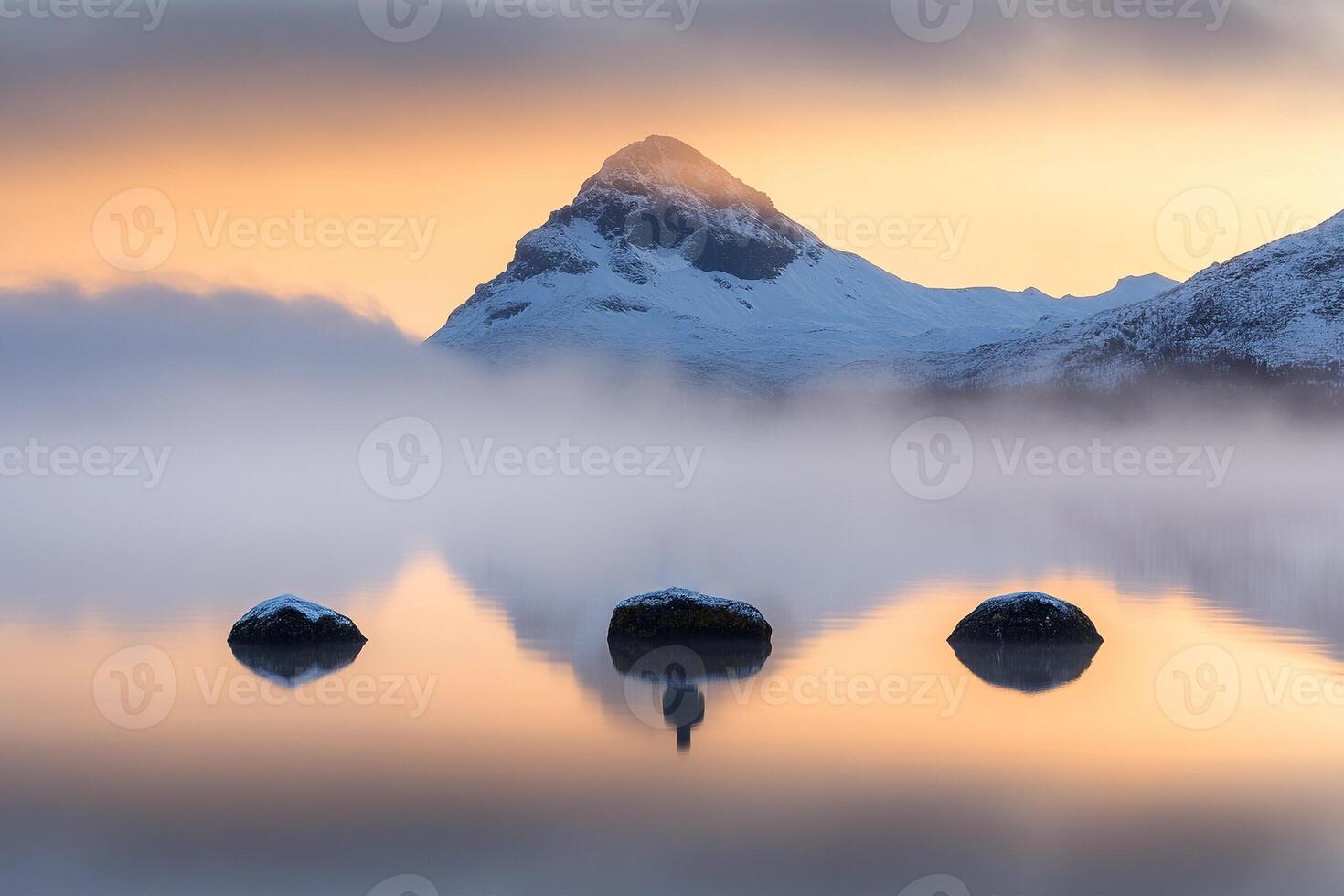 A mountain is reflected in the water at sunrise photo