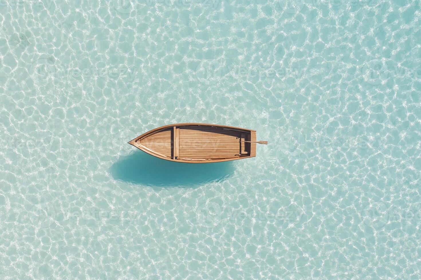 An aerial view of a boat floating in the ocean photo