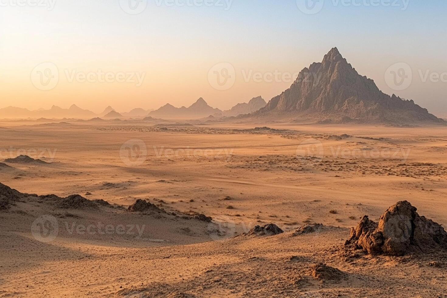 The desert is covered with rocks and sand photo
